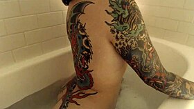 Inked Beauty Strips and Teases in Steamy Bath Show Finale