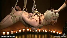 bound slave spreaded with chocolate