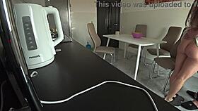 Wife sneaks a steamy fuck with neighbor in kitchen while husband works. Cheating to settle debts feels so wrong.