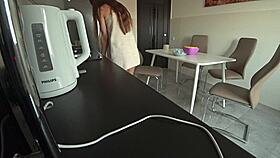 Wife sneaks a steamy fuck with neighbor in kitchen while husband works. Cheating to settle debts feels so wrong.