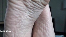 Stepmom Gives an Amazing Footjob to Her Stepdaughter's Boyfriend!