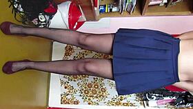 Model shows legs in skirt with stockings and shoes