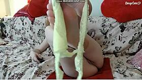 fit woman in lingerie pisses on panties, then smells it while fingering herself