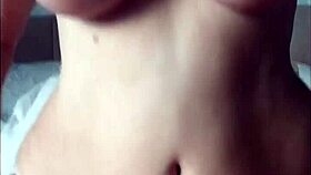 Naked woman inserts toys into her pussy