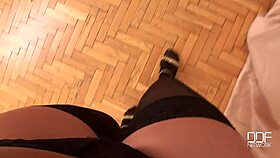 Lora Black Showcases Her Legs in Stockings During Solo Session