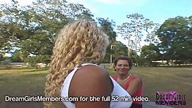 Two tanned BBFS flash their shaved pussies and pierced nipples outdoors intensely.