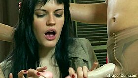 Detailed girl-on-girl lesbian creampie with strapon and toys in college setting.