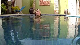 blonde babe wendy strips and swims nude in the pool