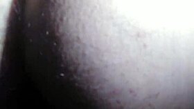 A person explores fisting with a large toy fist in a private session