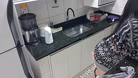 Sensual lady in the kitchen enjoys a moment of relaxation alone quietly