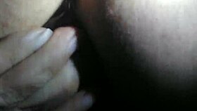 A person explores fisting with a large toy fist in a private session