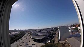 sarada enjoys naked moment at hotel window overlooking airport