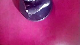 A person explores fisting with a large toy fist in a private session