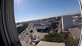 sarada enjoys naked moment at hotel window overlooking airport