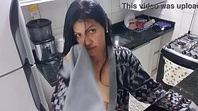 Sensual lady in the kitchen enjoys a moment of relaxation alone quietly