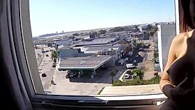 sarada enjoys naked moment at hotel window overlooking airport