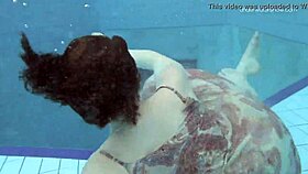 Anna Netrebko asks Lada Poleshuk, 'Ready for underwater fun?' in lesbian pool scene