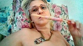 stella still, the blonde milf, sucks a delicious lollipop.