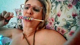 stella still, the blonde milf, sucks a delicious lollipop.
