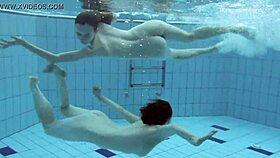 Anna Netrebko asks Lada Poleshuk, 'Ready for underwater fun?' in lesbian pool scene