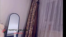 this dark hair stunner is on cam, showing off her big tits and more