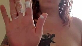 Massaging lotion onto mature boobs and tits with sensual care