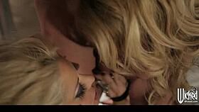 pair of tattooed goth girls share one studded accessory in threesome