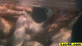 lesbians in bikinis teasing each other by the pool