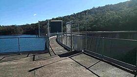 Asian slut JJ masturbates outdoors on the dam