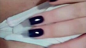 tattooed redhead shows tan lines close up