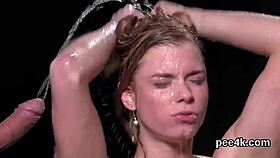 Stunning beauty receives warm liquid and splatters