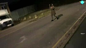 Watch this mature street whore shoving items into her shaved pussy on the run