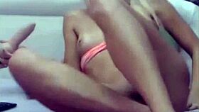 Blonde teen's perfect pussy teased by dildo on webcam