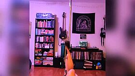 Blonde performs rock and roll strip in black lingerie.