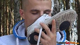 Can you believe this gay twink jacking off outdoors with a footjob fetish, cumming in high definition?
