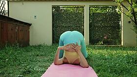 sexy yoga session in blue leggings on a green meadow 😍