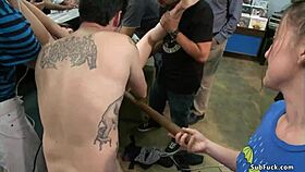 Bound babe gets double penetration banged in public shop.