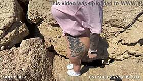 Blonde with big ass masturbates pussy to powerful squirt by the sea