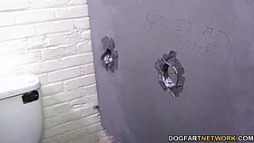 Ana Foxxx experiences a gloryhole encounter in a public outdoor setting.