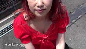 Reiko Ishii, mature Japanese lady, struts in bold red for a wild encounter.