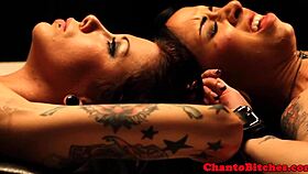 Lezdom mistress ruling over bound submissives