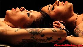 Lezdom mistress ruling over bound submissives