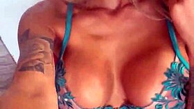 Russian pornstar Monika Fox poses in lingerie with pierced nipples and tattoos during backstage pornshoot