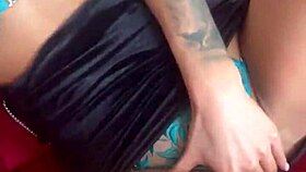 Russian pornstar Monika Fox poses in lingerie with pierced nipples and tattoos during backstage pornshoot