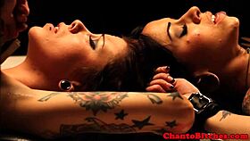 Lezdom mistress ruling over bound submissives