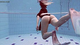 Roxalana cheh strips naked underwater in the pool.