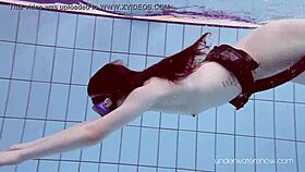 Roxalana cheh strips naked underwater in the pool.