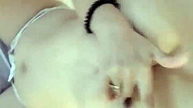 Asian amateur woman masturbates in casual home setting