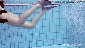 Roxalana cheh strips naked underwater in the pool.