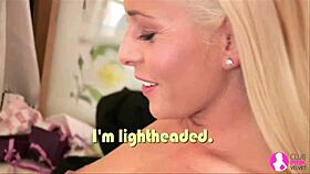 Intense blonde lesbians in stockings and lingerie passionately kiss and finger each other on the bed, using toys for masturbation.